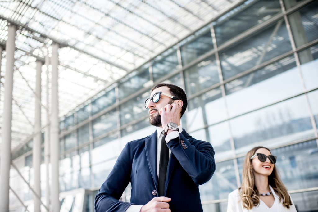 Business woman with security outdoors