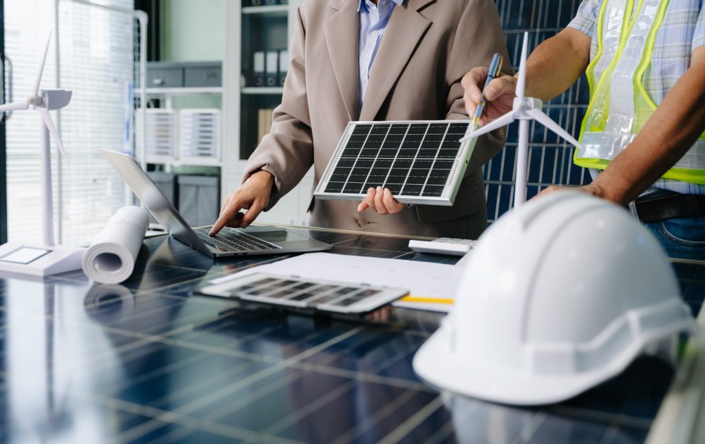Engineers collaborate on solar and wind energy, driving sustainability, innovation, and clean